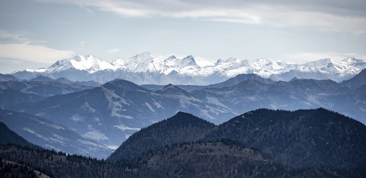 View of the Alpine foothills and main Alpine ridge with snow-covered peaks, summit of the Hohe Tauern with Gro&szlig;venediger, from the Austrian Schinder, Bavarian Alps, Mangfall mountains, Bavaria, Germany