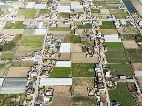 The semi rural district of La Algaida with its cultivated fields next to Sanl&uacute;car de Barrameda. Aerial view. Drone shot. C&aacute;diz province, Andalusia, Spain