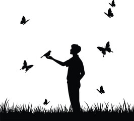 Silhouette of person holding bird with butterflies flying around in nature scene, peaceful wildlife moment in grassy landscape