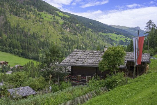 Farmhouse with South Tyrolean flag, H&ouml;fewanderweg, Ulten, South Tyrol, Italy