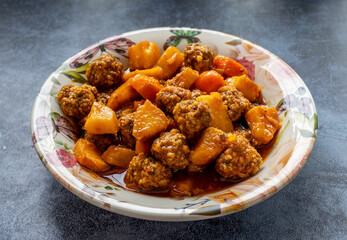 Juicy small meatballs with potatoes and carrots