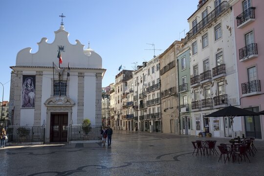 Capela de Nossa Senhora da Saude, on the right Old town houses in Rua da Mouraria, Lisbon, Portugal
