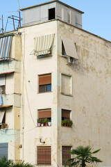 Vertical image of a traditional Albanian-style facade building blended with Mediterranean simplicity. Perfect for renting, buying, relocating, and agency-focused property promotion.