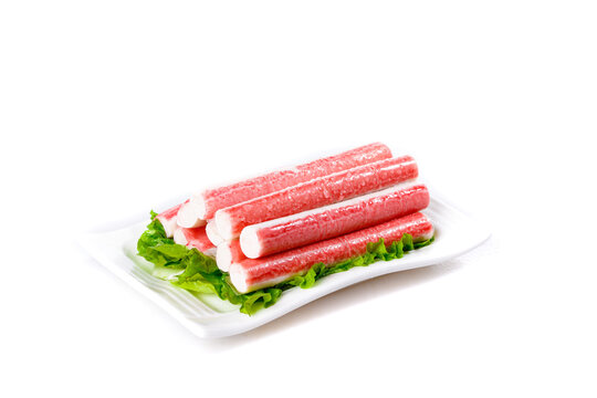 Fresh Crab Sticks on White Plate with Lettuce Garnish for Seafood Cuisine