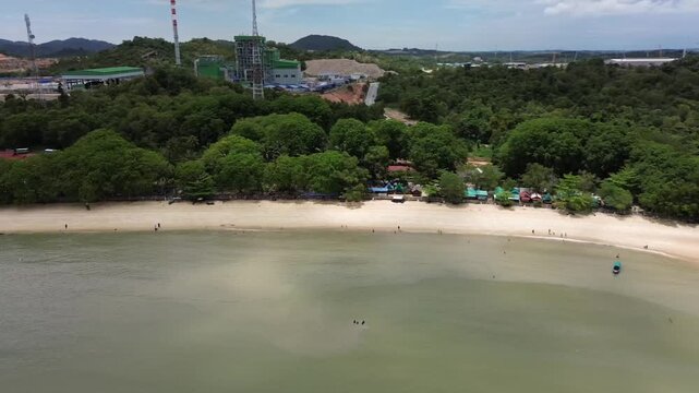 Aerial view of beautiful blue waters and white sandy beaches at Pelawan beach, Karimun Regency, Riau Islands, Indonesia - drone flying towards the beach