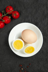 Boiled Eggs with Tomatoes on Dark Slate Background - Healthy Breakfast Food Photography