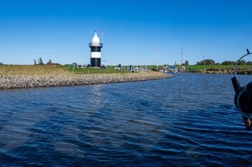 Small lighthouse in Wremen on the North Sea coast, seen from a boat