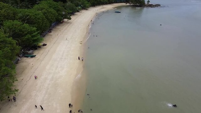 Aerial view of beautiful blue waters and white sandy beaches at Pelawan beach, Karimun Regency, Riau Islands Indonesia - drone flying over the beach