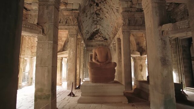 Buddha statue in a ancient khmer temple, of the angkor wat complex in cambodia, Siem Reap. Archeology concept.