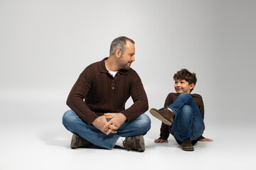 Joyful moments shared between a father and his little son in a cozy indoor setting