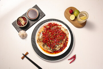 Chinese Steamed Fish Head with Chopped Red Peppers and Chili Sauce - Traditional Asian Cuisine Dish