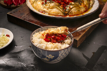 Fresh Cooked Fish Fillet Over Rice in Traditional Bowl - Asian Cuisine Meal Preparation