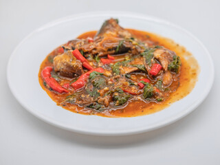 Canned fish basil stir-fry served with hot steamed rice, presented in a vibrant and appetizing Thai food