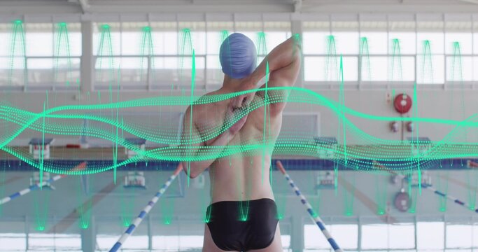 Stretching male swimmer from behind at pool, wearing cap, black briefs, facing lanes, teal waveform - Powered by Adobe