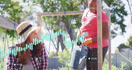 Kneeling woman wearing straw hat guiding girl watering plants with blue can at garden, data overlay