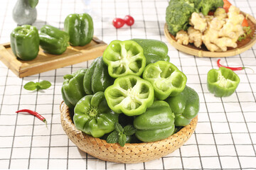Fresh Green Bell Peppers in Wicker Basket - Healthy Organic Vegetables for Cooking