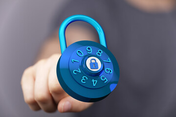 Hand touching a blue padlock, a visual representation of security, privacy, and digital protection. Concept of
