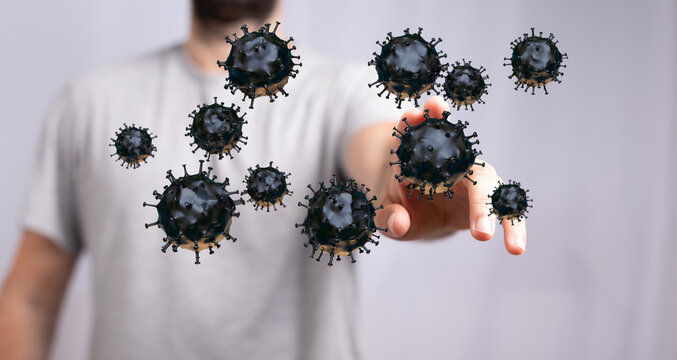 Image of a person interacting with digitally rendered coronavirus particles representing the COVID-19 pandemic - Powered by Adobe