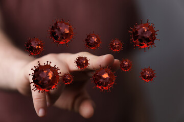 Image depicting the concept of a hand interacting with Coronavirus particles, representing disease, pandemic,