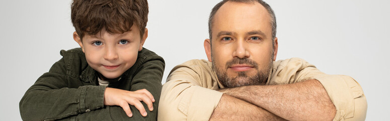 Obraz premium Caring moments shared between a father and his little son in a warm, joyful embrace