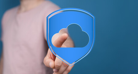 A person touching a cloud symbol inside a shield. Symbolizes cloud security, data protection, and online safety