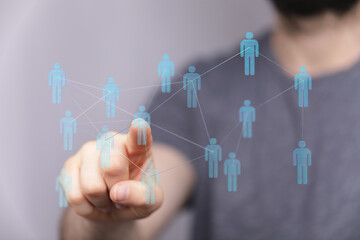 Human hand interacting with a digital network, representing concepts like connection, technology, social network, and innovation. Perfect for il