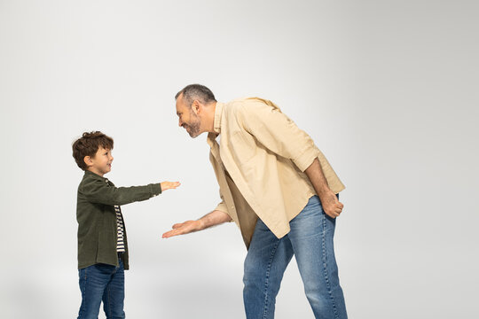 Father and son share a joyful moment of connection during playtime at home - Powered by Adobe