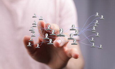 Hand reaching towards a digital network, representing concepts of connectivity, teamwork, and business strategy. Visualizing ideas of collaborat