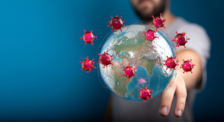 Abstract illustration of a person interacting with a globe covered in viruses, representing global pandemic an