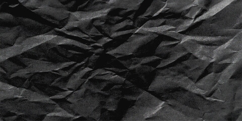 Aged black fabric and brown paper texture, crushed, wrinkled, and creased material surface. Black crumpled paper texture with folds. Wrinkled craft paper background, rough cardboard surface, wallpaper