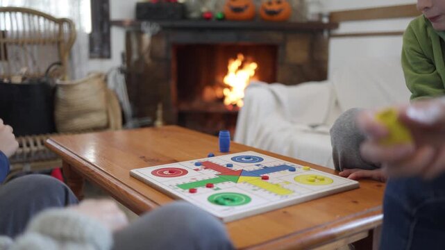 family, board game, playing, fireplace, cozy, home, leisure, ludo, togetherness, winter, indoor, recreation, children, adults, bonding, connection, fun, activity, lifestyle, entertainment, weekend, ga