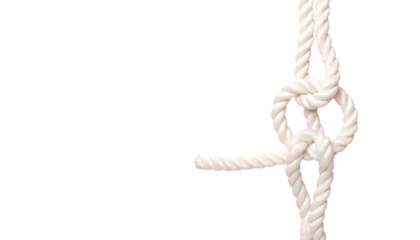Close-up of a white rope tied in a complex knot against a stark black background (2)