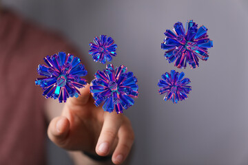 Artistic rendering of a hand touching geometric glowing orbs. Ideal for digital art, technology, future themes