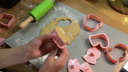 Baking holiday gingerbread cookies in a cozy family kitchen