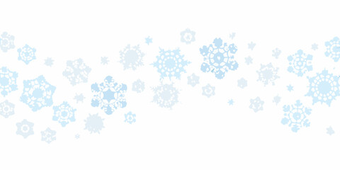A seamless pattern of delicate light blue snowflakes on a white background