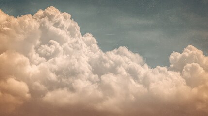 Vintage cloudy sky background with soft sepia tones for retro design projects