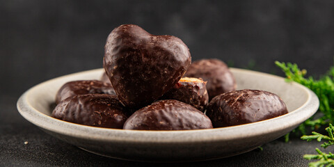 Gingerbread chocolate heart shaped honey cakes Christmas sweet dessert new year natural product tasty snack fresh delicious gourmet food background on the table rustic top view copy space