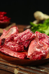 Fresh Raw Beef Cuts on Wooden Board with Herbs