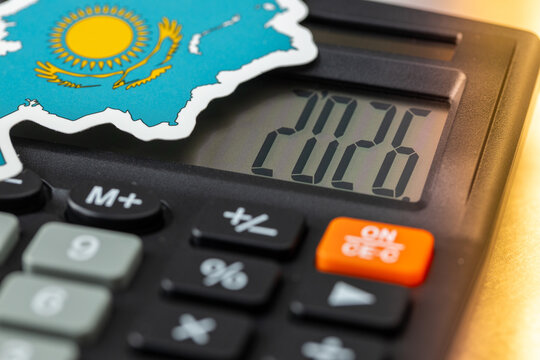 Kazakhstan 2026. Economic and development prospects, financial analysis. The shape and symbol of Kazakhstan and a calculator with the date 2026. Close-up