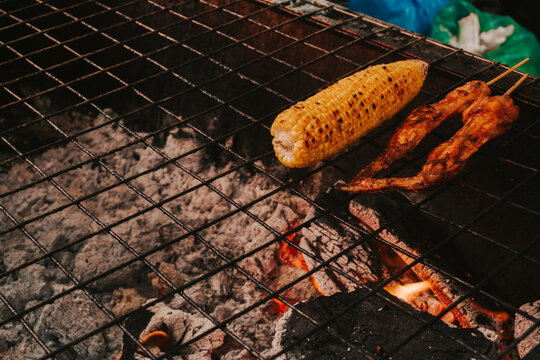 Fresh corn is slowly grilled. Hot appetizers for barbecue party - Powered by Adobe