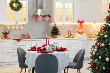 Festive table setting with Christmas decor in kitchen. Interior design