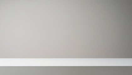 Grey wall background with white shelf.