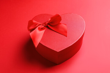 Happy Valentine's Day. Heart shaped gift box on red background, closeup