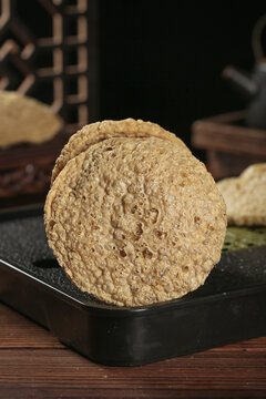 Henan Crispy Dried Tofu Rounds Vegetarian Protein Food on Slate Board