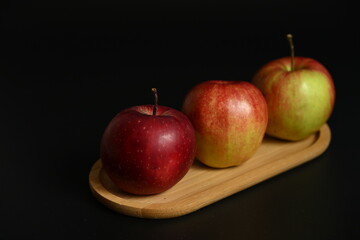 High-contrast studio shot highlighting the vibrant colors and smooth peel of the fruit. Perfect for themes of healthy diet and clean food advertising.