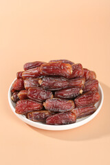 Dried Dates Fruit on White Plate Golden Background Healthy Natural Organic Sweet Snack Food Photography
