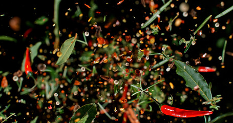Flying mixed spices captured in mid-air against a dark background. Colorful chili, herbs, and pepper flakes suspended in motion, creating a dynamic culinary explosion. High-resolution macro photo.