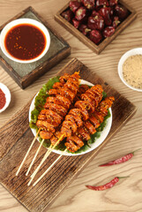 Henan Grilled Spiced Wheat Gluten Skewers Traditional Chinese Street Food with Hot Sauce and Dates