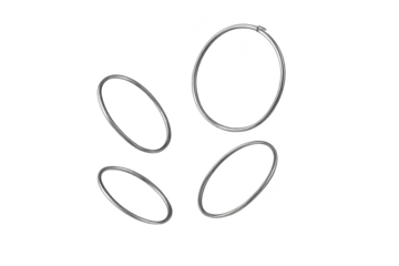 Four metallic oval rings isolated on a transparent background, shiny silver