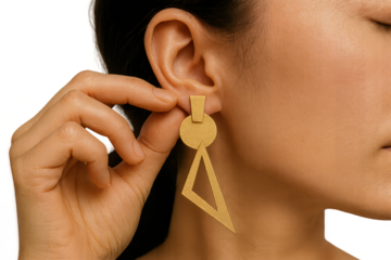 Gold geometric earring, woman's ear, isolated on transparent background.
